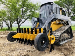 CL-FAB-SKID-STEER-RIPPER-ON-DEERE-333E-WITH-GAUGE-WHEELS-e1528988238746